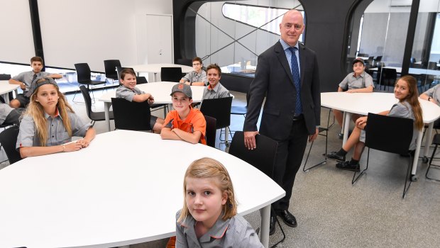 Principal Colin Simpson and students inside the new Richmond High