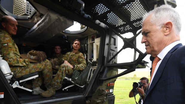 Mr Turnbull inspects a Boxer armoured vehicle at Enoggera Barracks.