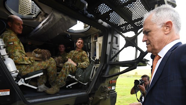 Mr Turnbull inspects a Boxer armoured vehicle at Enoggera Barracks.