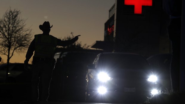 Texas troopers help redirect traffic near the site of another explosion in Austin on Tuesday.
