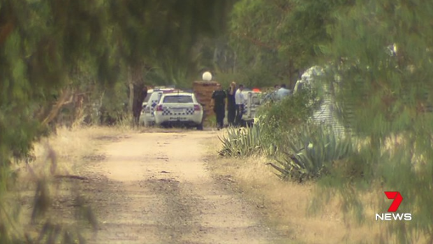 Police at the scene of an alleged stabbing in Strathmerton. 