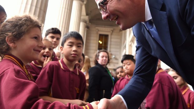 Premier Daniel Andrews greets some students at State Parliament.  