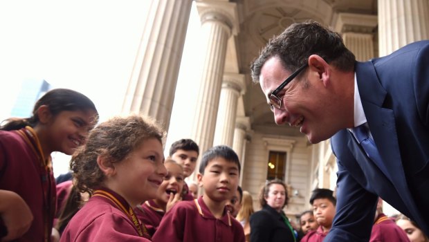 Premier Daniel Andrews greets some students at State Parliament.  