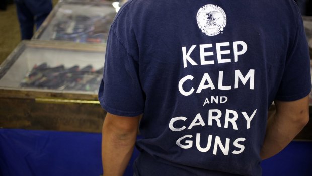 A man attending the 2015 Knob Creek Machine Gun Shoot in West Point, Kentucky, wears an NRA T-shirt.