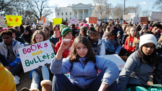 Students rally in front of the White House in Washington on Wednesday. Millions are expected to march in Washington tomorrow.