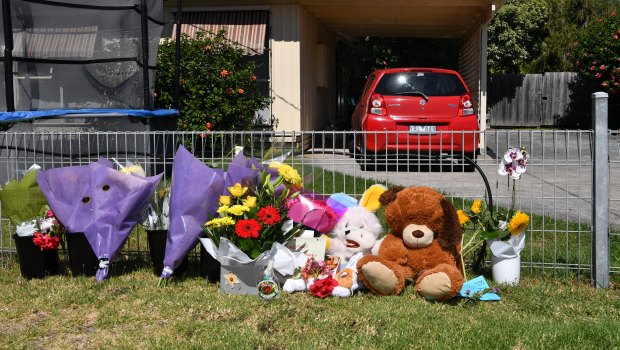 Flowers and teddies left outside the Alma Street property in Tootgarook on Friday.