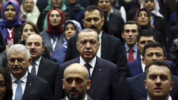 The regime of Turkish President Recep Tayyip Erdogan, center, has jailed thousands of people accused of being plants for Fethullah Gulen. 