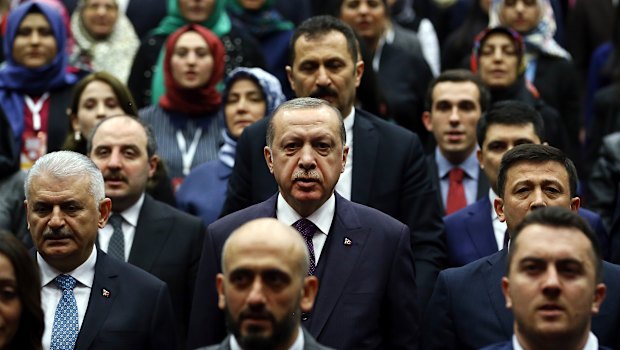 The regime of Turkish President Recep Tayyip Erdogan, center, has jailed thousands of people accused of being plants for Fethullah Gulen. 