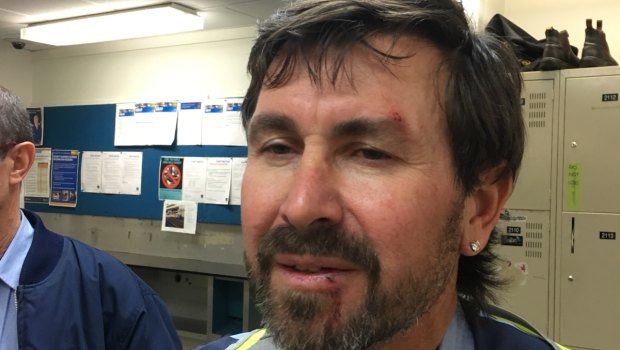 The bus driver suffered cuts to his face after the alleged assault involving a cyclist.
