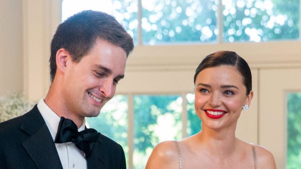 Snapchat CEO Evan Spiegel, pictured with his wife, Aussie model Miranda Kerr, has redesigned the app to appeal to older users.