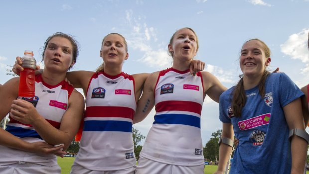 Isabel Huntington sings the club song with teammates on Sunday