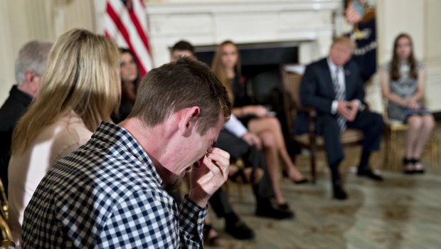 Samuel Zeif, Marjory Stoneman Douglas High School student, cries after speaking at a listening session with Donald Trump on gun violence with high school students, teachers and parents in the State Dining Room of the White House.