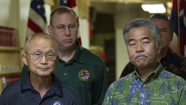 Hawaii Gov. David Ige (right) addresses the media after the false alert. 