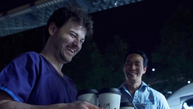 Two night shift workers at St Vincent's hospital collect their coffees on a quick break.