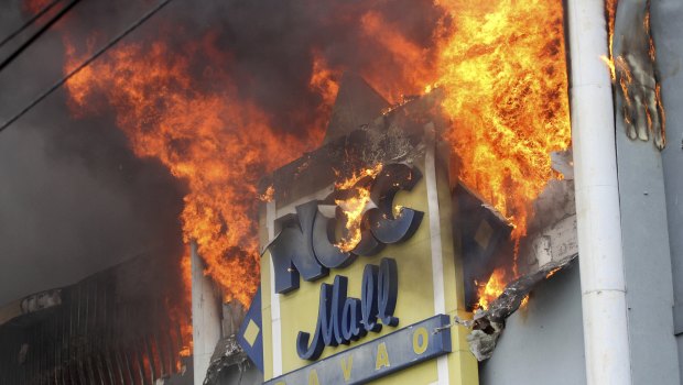 A fire rages on at a shopping mall.