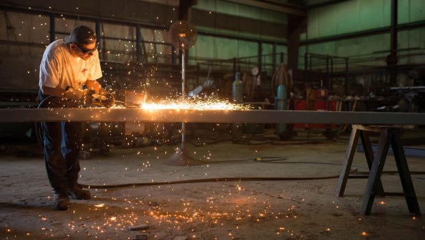 A metal worker preps steel for the base framework of a modular farming unit at the Modular Farms Co. manufacturing facility in Cornwall, Ontario, Canada.