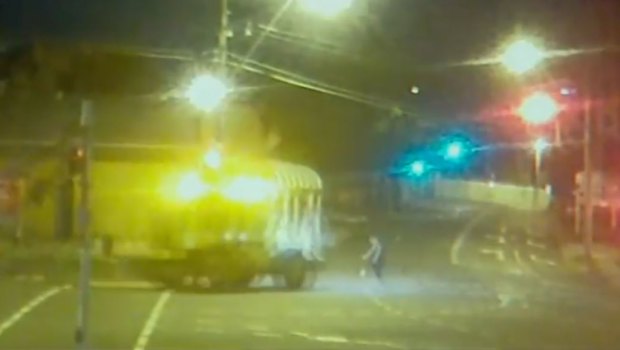CCTV reveals the moment a woman was struck by a tractor crane in Bowen Hills overnight on Thursday