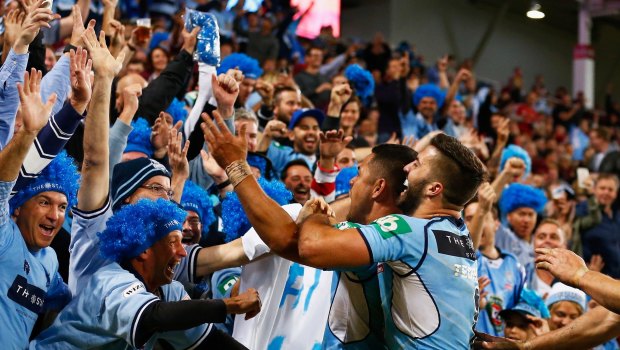 Money-spinner: Jarryd Hayne of the NSW Blues celebrates scoring a try during a State of Origin game.. 