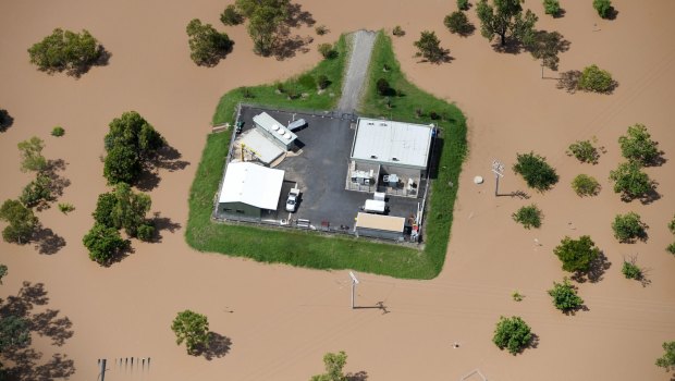 Before the peak:  A property is surrounded by floodwaters near Rockhampton in teh aftermath of Cyclone Debbie.