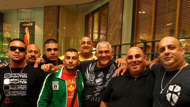 ‘Little’ Al Taouil in green jacket with Mick Gatto and others in 2012. The men are not accused of any wrongdoing.