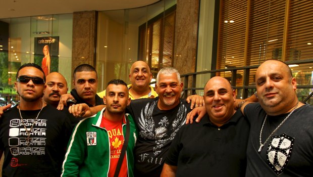 ‘Little’ Al Taouil in green jacket with Mick Gatto and others in 2012. The men are not accused of any wrongdoing.