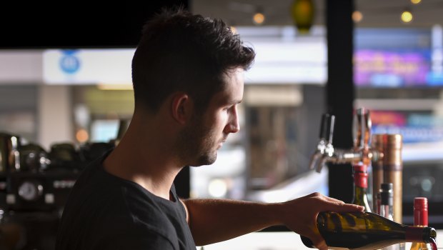 The Hills Wine Bar's manager Angus Brettingham-Moore pours a legal drop in "dry zone" Surrey Hills.