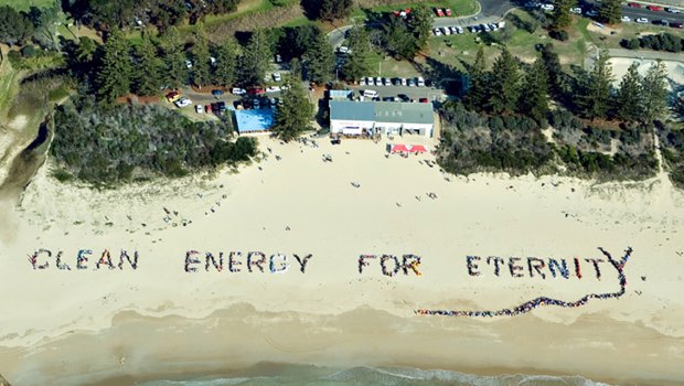 Tathra has long been a focus of climate change and renewable energy support, as seen in this beach sign with 3000 people in 2006.