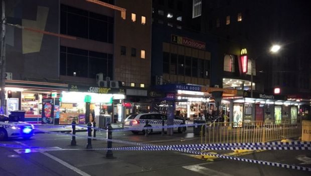 Police at the scene of the stabbing in Melbourne's CBD on Monday morning. Photo: Robyn Grace
