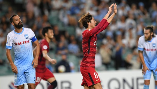 Shoma Doi (centre) of the Antlers reacts after scoring against Sydney during the AFC Champions League Group H match between at Allianz Stadium on Wednesday night.