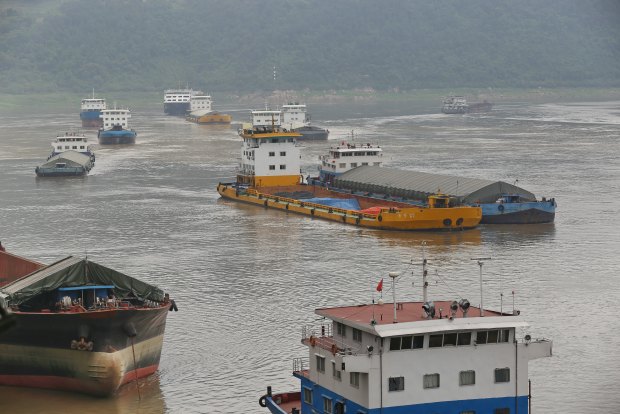 Cargo ships sail into Chongqing's free-trade port, connected to 13 rail lines.