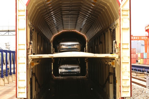 Cars made in Shanghai loaded on a train to Chongqing.