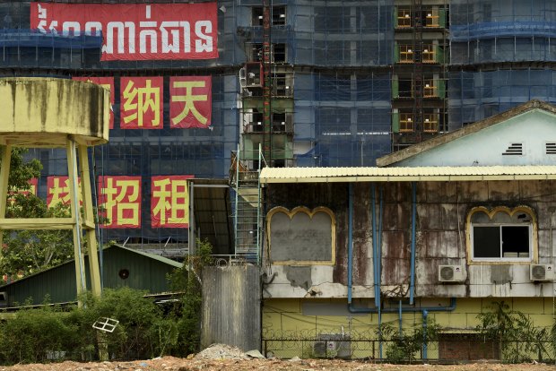 Towers in the Blue Bay complex rise up to dwarf Cambodian buildings on Independence Beach. The project includes a private beach. 