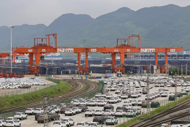 Cars and containers ready to be freighted out of Chongquin. 