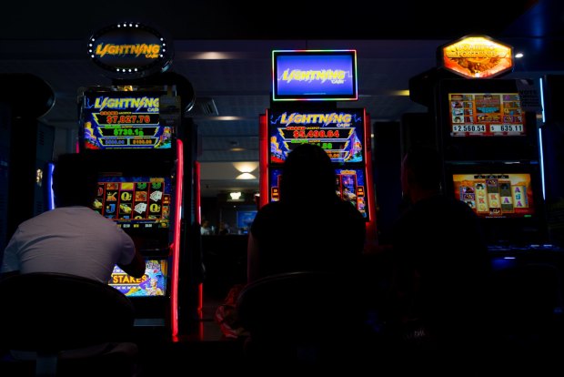 The standardised,
windowless decor of
many hotel gaming
lounges fosters a sense
of familiarity. NSW alone has 92,000 poker machines outside its casinos, compared with 43,000 in Queensland, the state with the next highest number. Western Australia has none.