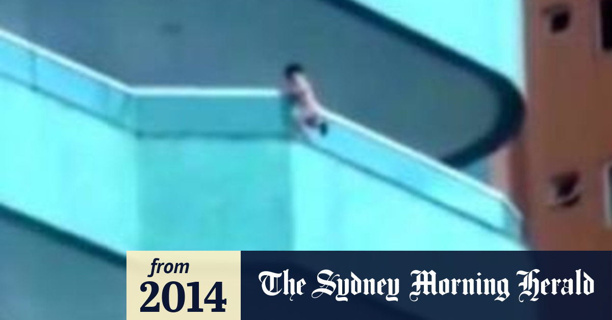 Toddler filmed dangling from a balcony before being rescued