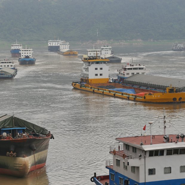 Cargo ships sail into Chongqing's free-trade port, connected to 13 rail lines.