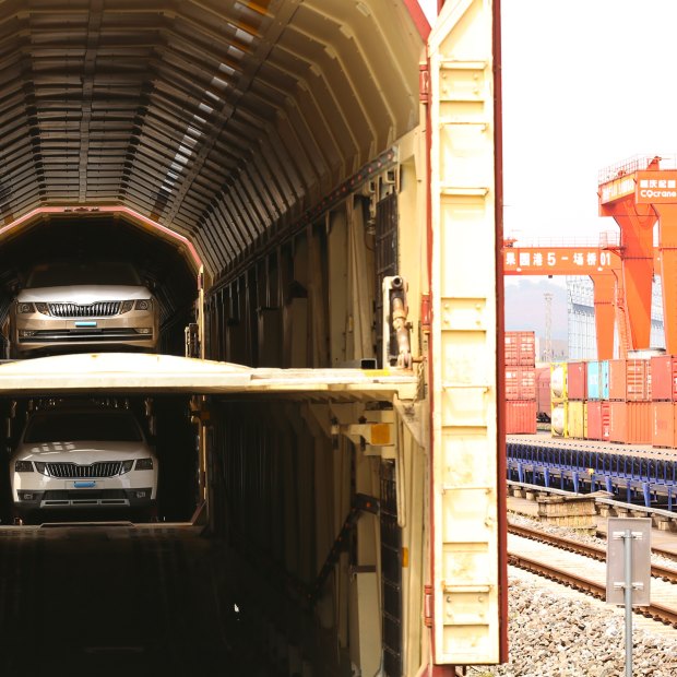 Cars made in Shanghai loaded on a train to Chongqing.