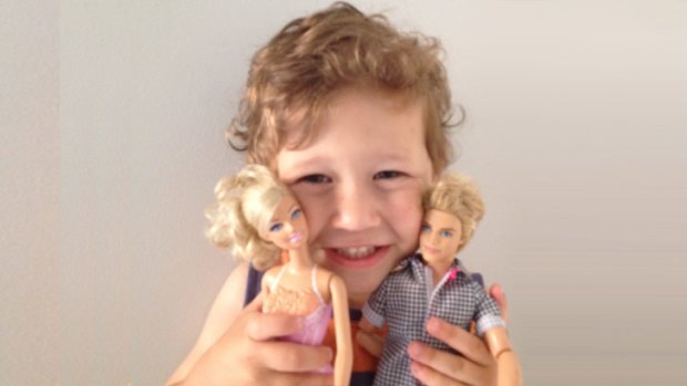 Little boy playing 2024 with barbie dolls