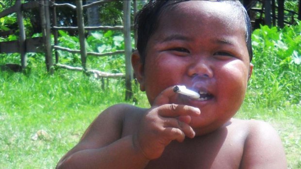 Indonesia's 'smoking baby' kicked his habit but the battle against