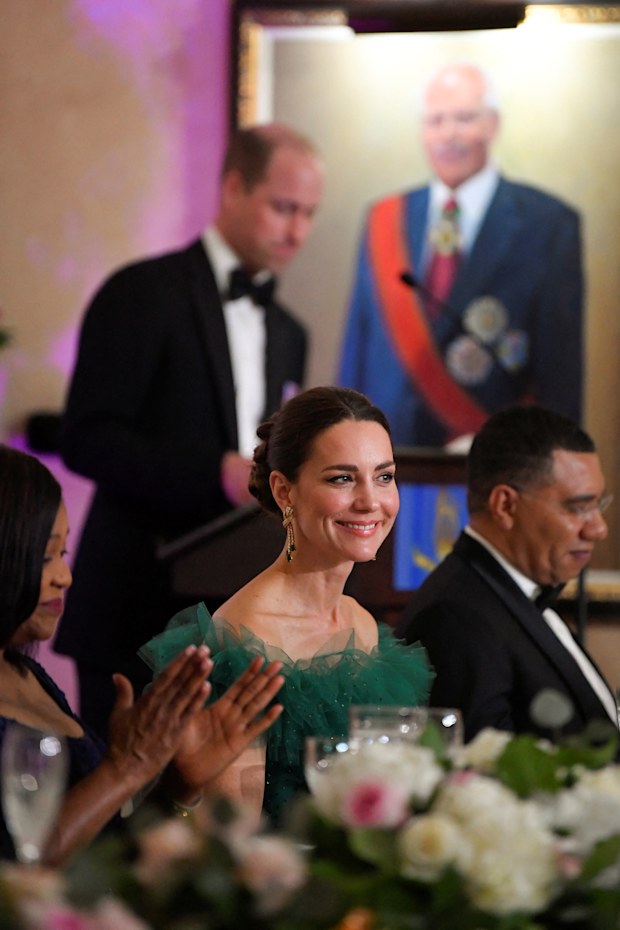 Catherine Duchess of Cambridge and Prime Minister of Jamaica Andrew Holness (R) listen as Prince William, Duke of Cambridge speaks during a dinner hosted by the Governor General of Jamaica at King's House on March 23, 2022 in Kingston, Jamaica. The Duke and Duchess of Cambridge are visiting Belize, Jamaica and The Bahamas on behalf of Her Majesty The Queen on the occasion of the Platinum Jubilee. The 8 day tour takes place between Saturday 19th March and Satu