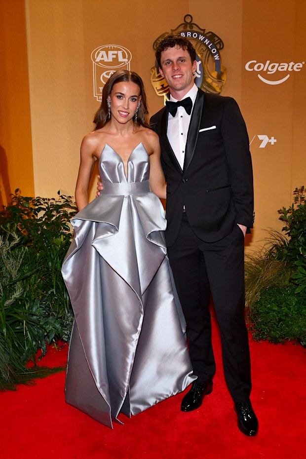 Max Holmes of the Geelong Cats and partner Jess Butler arrive ahead of the 2026 Brownlow Medal at Crown Palladium on September 21, 2026 in Melbourne, Australia.