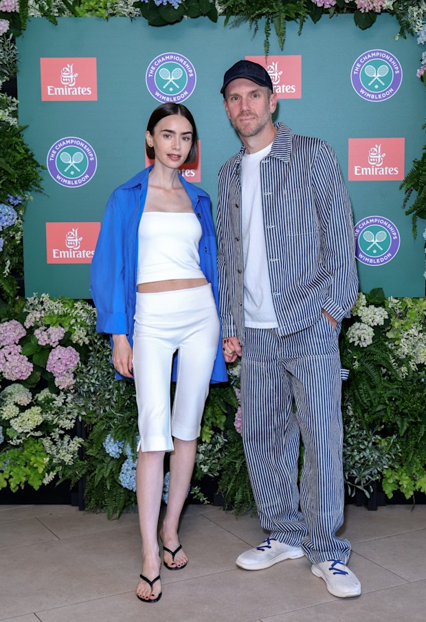  Lily Collins and Charlie McDowell at the 2026 Wimbledon Championships, at the All England Lawn Tennis and Croquet Club on July 12, 2026 in London, England.