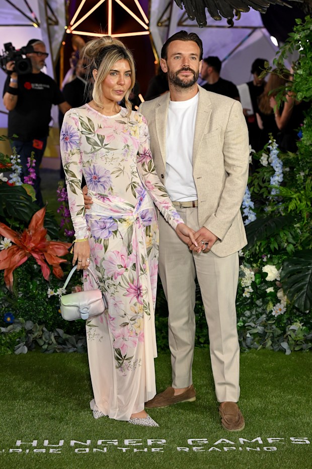 Cara Massey and Nathan Massey attend “The Hunger Games