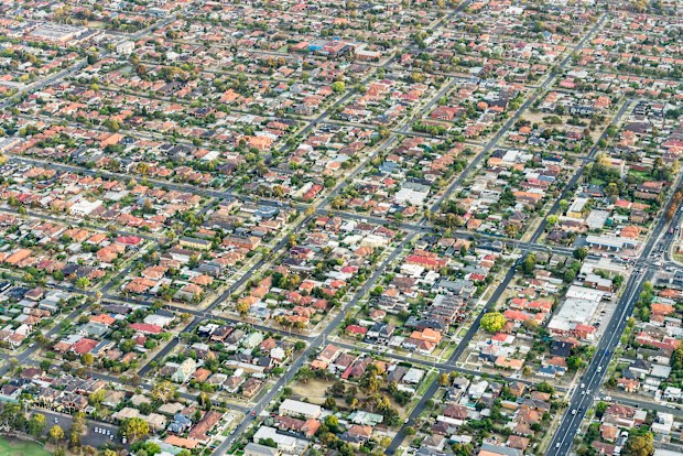 S+ An isometric angled view of suburban houses, shops and roads in Melbourne, Australia. Aerial photograph, taken from a hot air balloon.