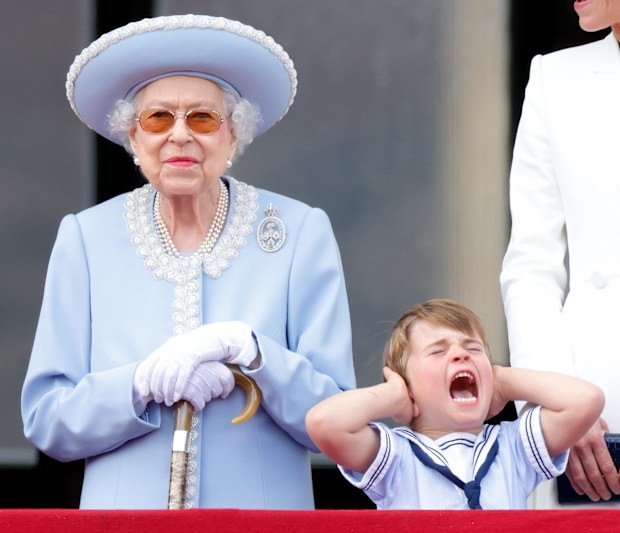 Queen Elizabeth II and Prince Louis of Cambridge watch a flypast from the balcony of Buckingham Palace during Trooping the Colour on June 2, 2022 in London, England.