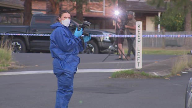 A heavy police presence remains on the Merrylands West street.