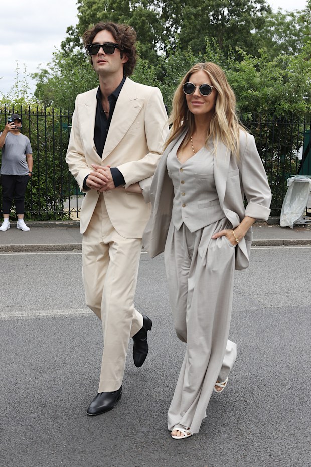Sienna Miller and Oli Green at the 2026 Wimbledon Championships at the All England Lawn Tennis and Croquet Club, London. Saturday July 4, 2026.
