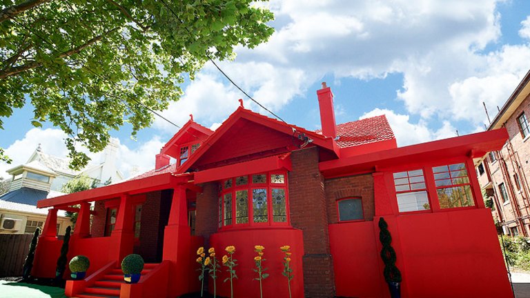 Two Grey Rooms In A Big Red House