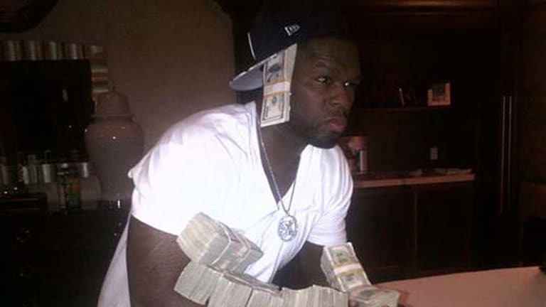 50 Cent shows the world he's coining it in