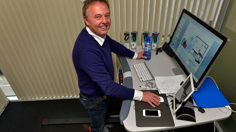 Treadmill at the desk lets Steve stand and deliver